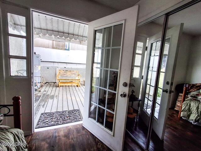 doorway to outside with dark wood finished floors