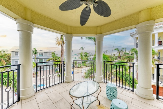 balcony with ceiling fan and a residential view