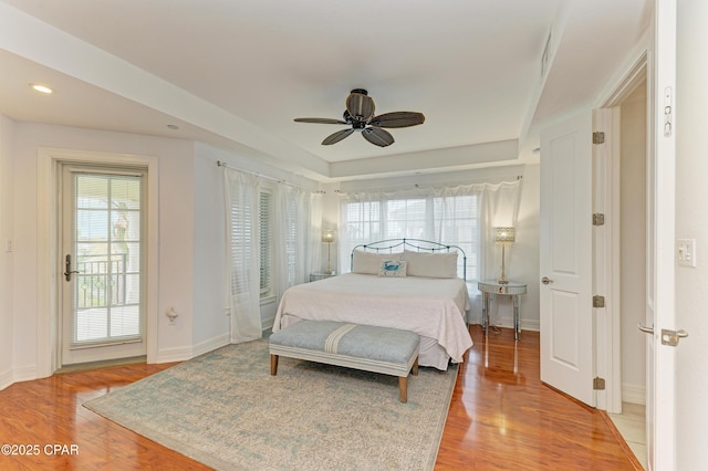 bedroom with a ceiling fan, recessed lighting, light wood-style flooring, and baseboards