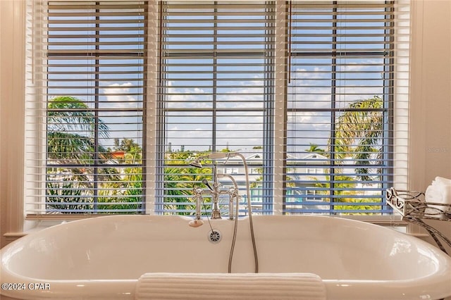 bathroom with a freestanding tub