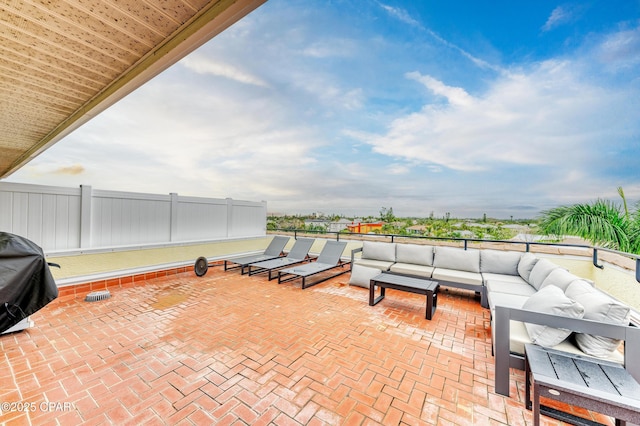 view of patio / terrace featuring fence and an outdoor hangout area