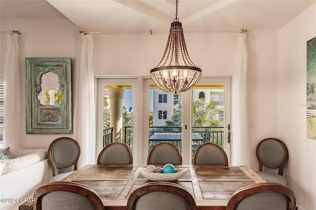 dining space featuring an inviting chandelier