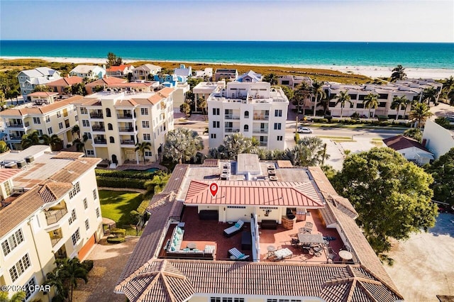 bird's eye view featuring a view of the beach and a water view