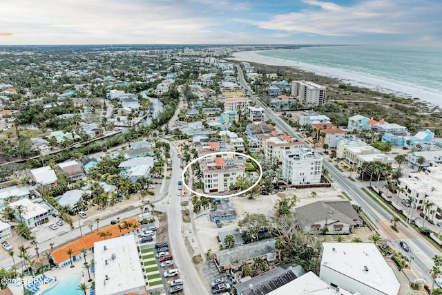 drone / aerial view featuring a water view and a beach view