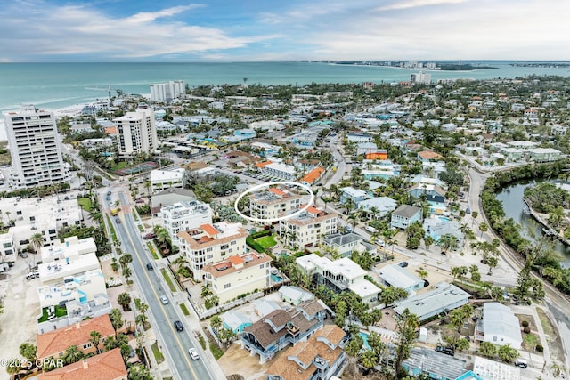 drone / aerial view featuring a water view and a city view