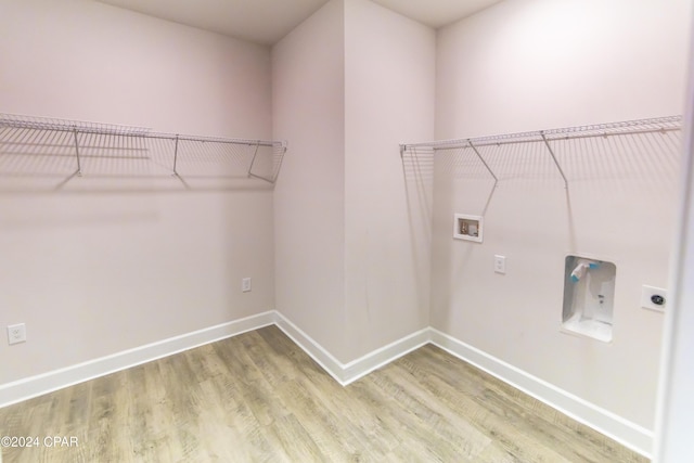 laundry room featuring hardwood / wood-style floors, washer hookup, and hookup for an electric dryer