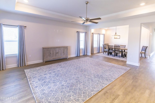 interior space with hardwood / wood-style flooring, crown molding, and a wealth of natural light