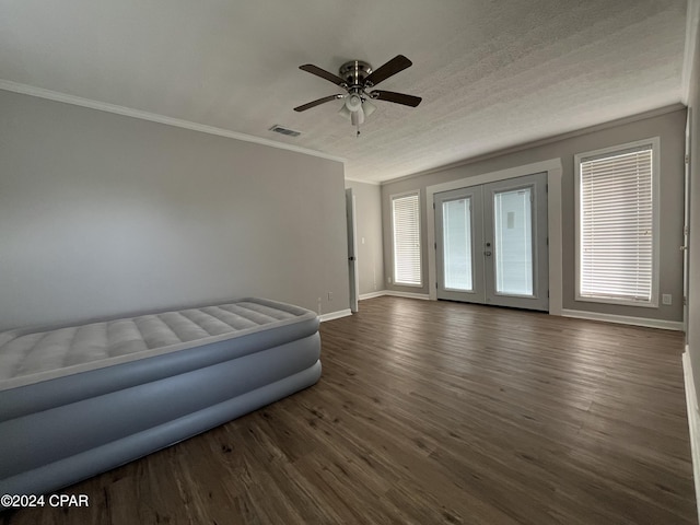 interior space featuring french doors, plenty of natural light, and dark hardwood / wood-style floors