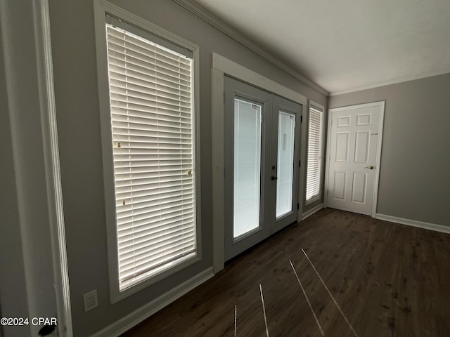 entryway featuring french doors, dark hardwood / wood-style floors, a wealth of natural light, and crown molding