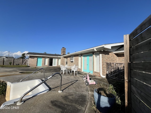 rear view of property with a patio area