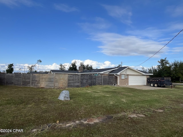 view of yard featuring a garage