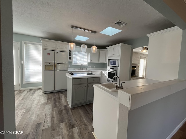 kitchen featuring ceiling fan, white cabinetry, white appliances, and sink