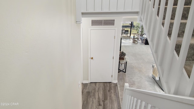 corridor featuring hardwood / wood-style flooring