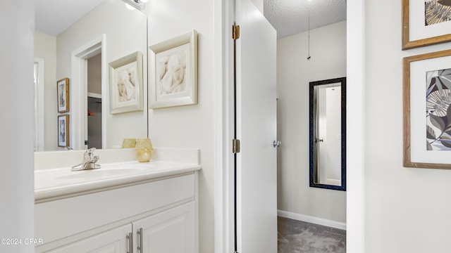 bathroom featuring vanity and a textured ceiling