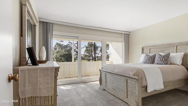 bedroom featuring light carpet