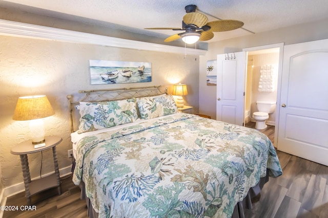 bedroom with ensuite bath, ceiling fan, dark hardwood / wood-style flooring, and a textured ceiling