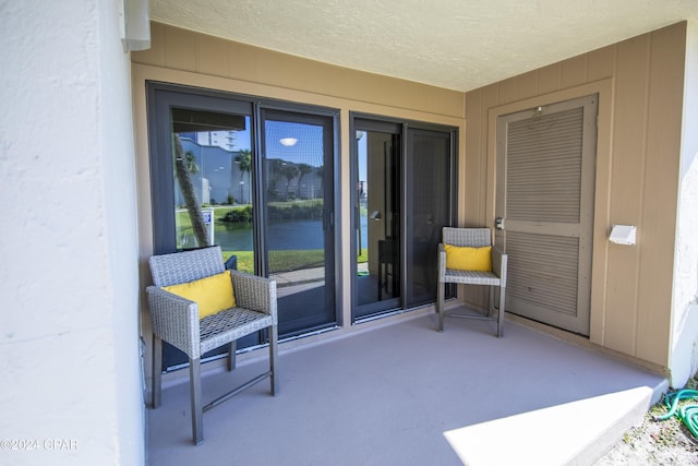 entrance to property with a patio