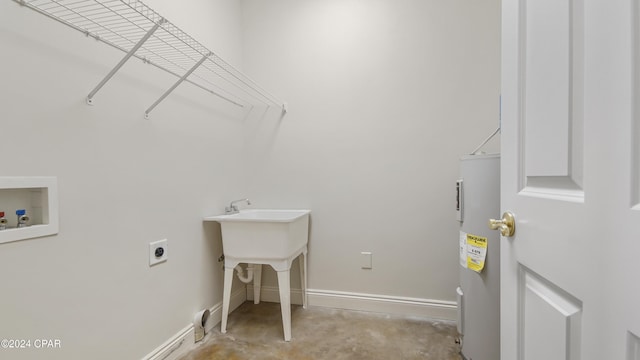 clothes washing area featuring baseboards, hookup for an electric dryer, laundry area, water heater, and washer hookup