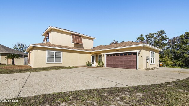 rear view of house with a lawn, a patio area, and french doors