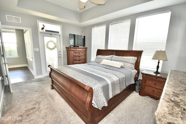 carpeted bedroom with ceiling fan