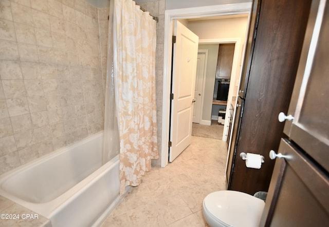 bathroom featuring toilet, tile patterned flooring, and shower / tub combo with curtain