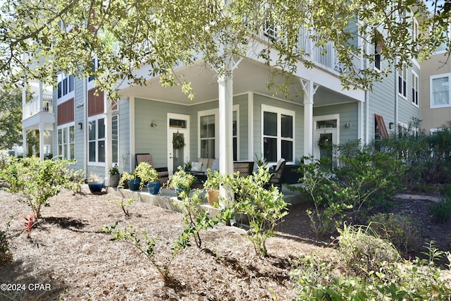 rear view of house with a porch