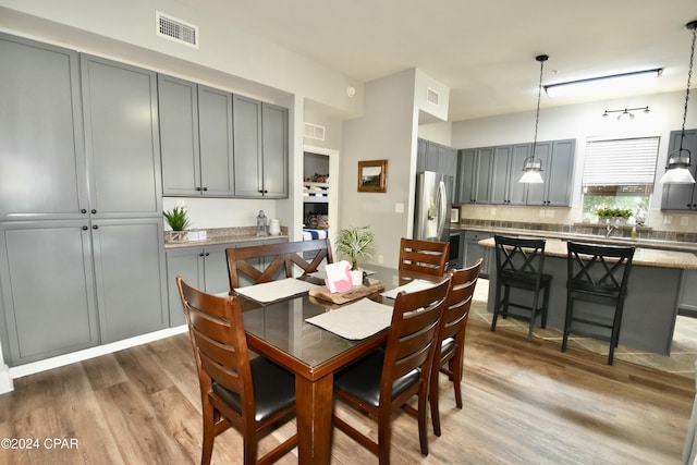 dining room with dark wood-type flooring