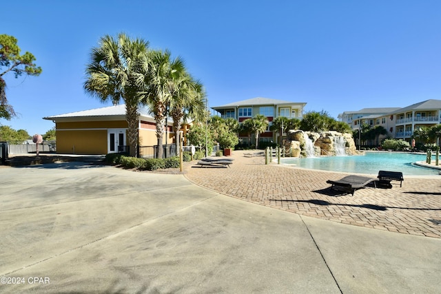 view of pool with pool water feature