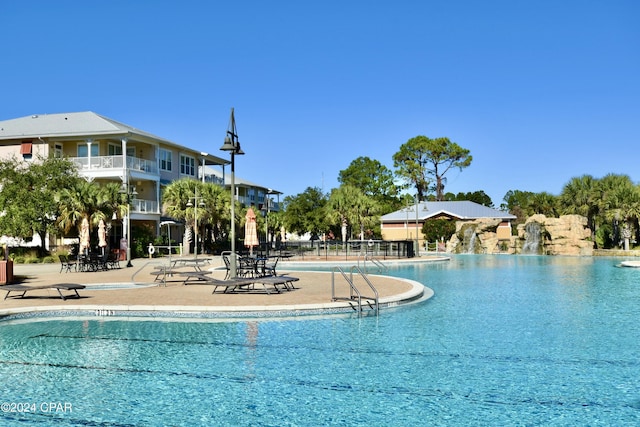 view of swimming pool with a patio