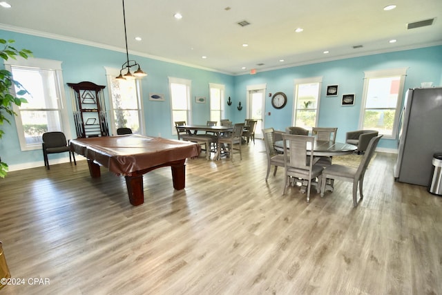 rec room with light wood-type flooring, crown molding, a healthy amount of sunlight, and billiards