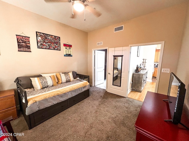 living room featuring carpet and ceiling fan