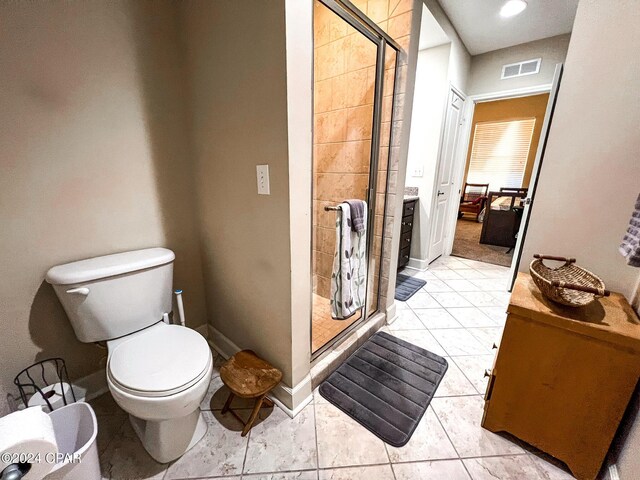 bathroom with walk in shower, tile patterned floors, toilet, and vanity