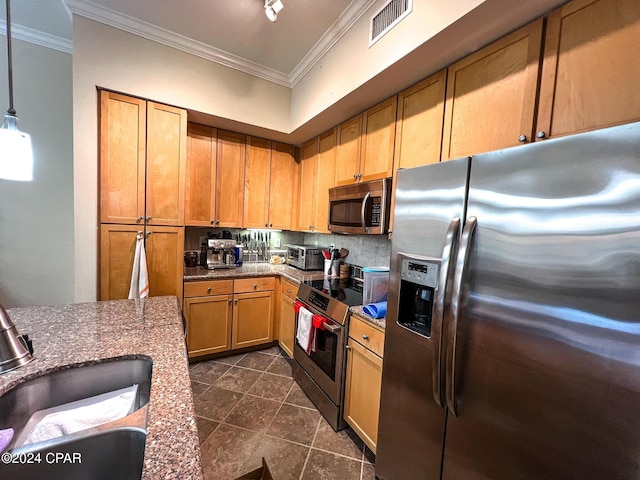 kitchen with pendant lighting, stainless steel appliances, crown molding, and sink