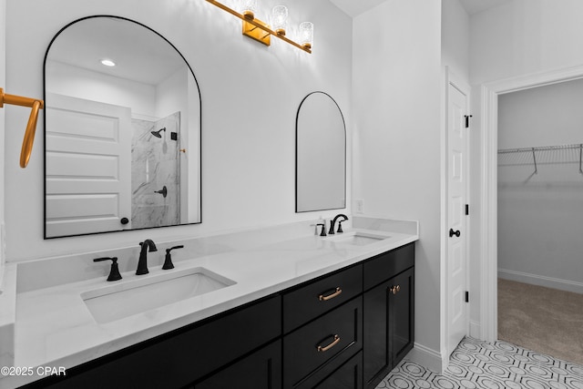 bathroom with tile patterned floors, vanity, and a shower