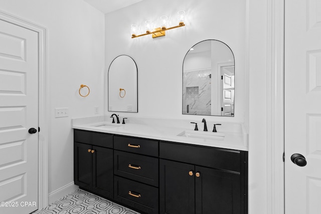 bathroom featuring tile patterned flooring, vanity, and walk in shower