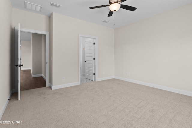 unfurnished bedroom with light colored carpet and ceiling fan