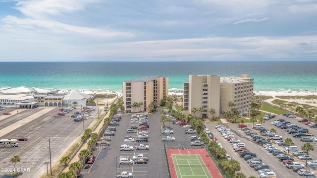 aerial view with a water view and a beach view