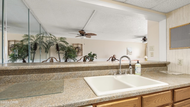 kitchen with ceiling fan and sink