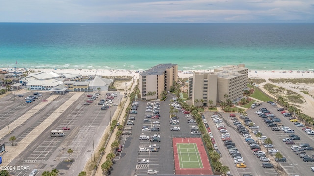 birds eye view of property featuring a view of the beach and a water view