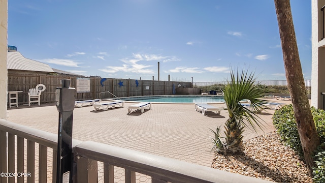 view of swimming pool with a patio