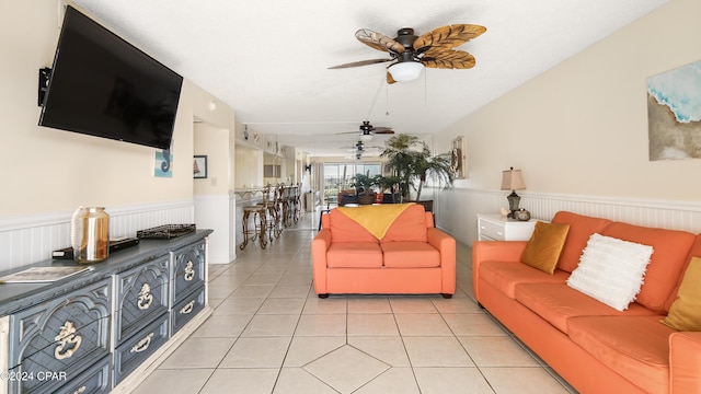 tiled living room featuring ceiling fan