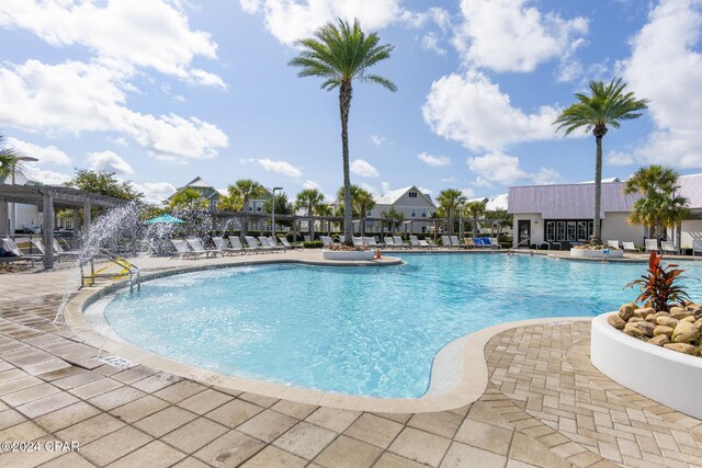 view of pool featuring a pergola and a patio