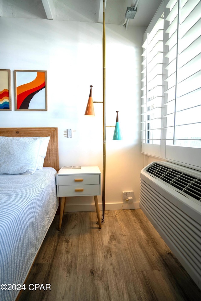 bedroom featuring dark wood-type flooring