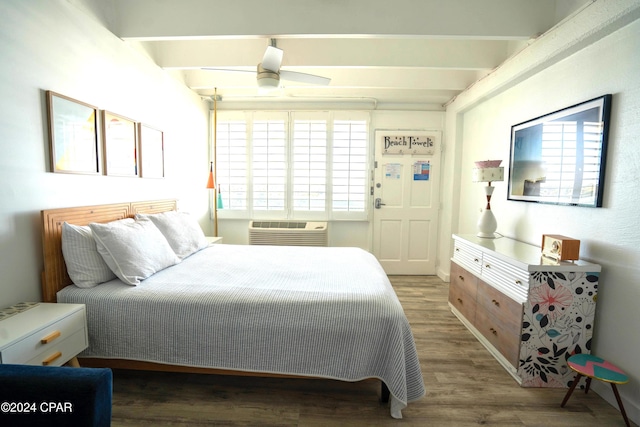 bedroom with beamed ceiling, ceiling fan, dark hardwood / wood-style flooring, and an AC wall unit