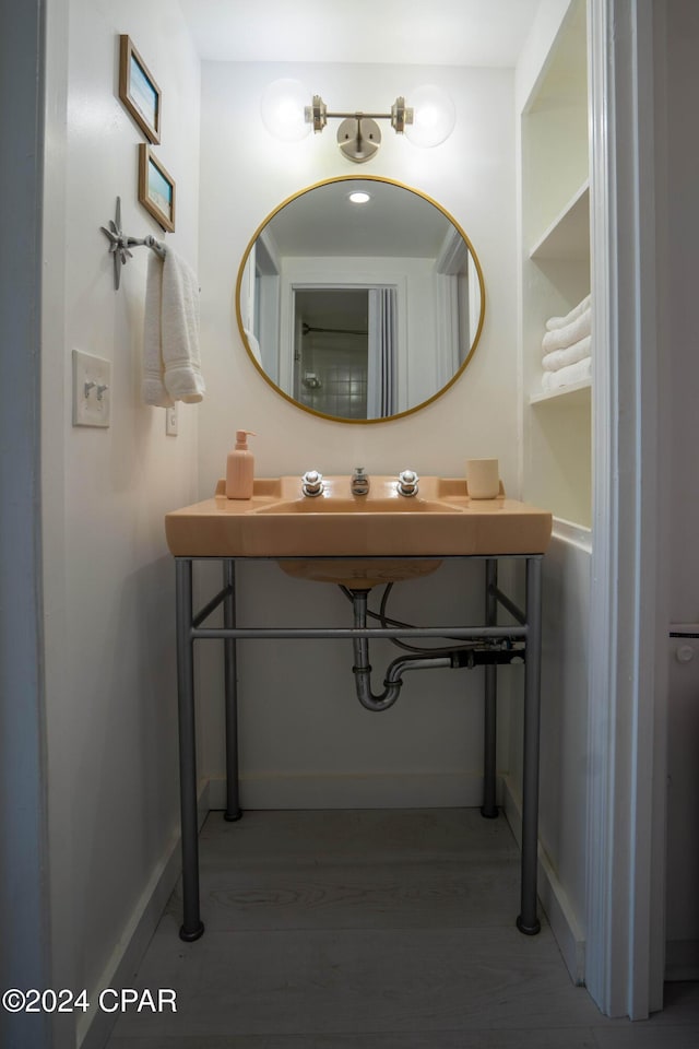 bathroom featuring vanity and hardwood / wood-style flooring