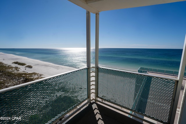 balcony with a beach view and a water view