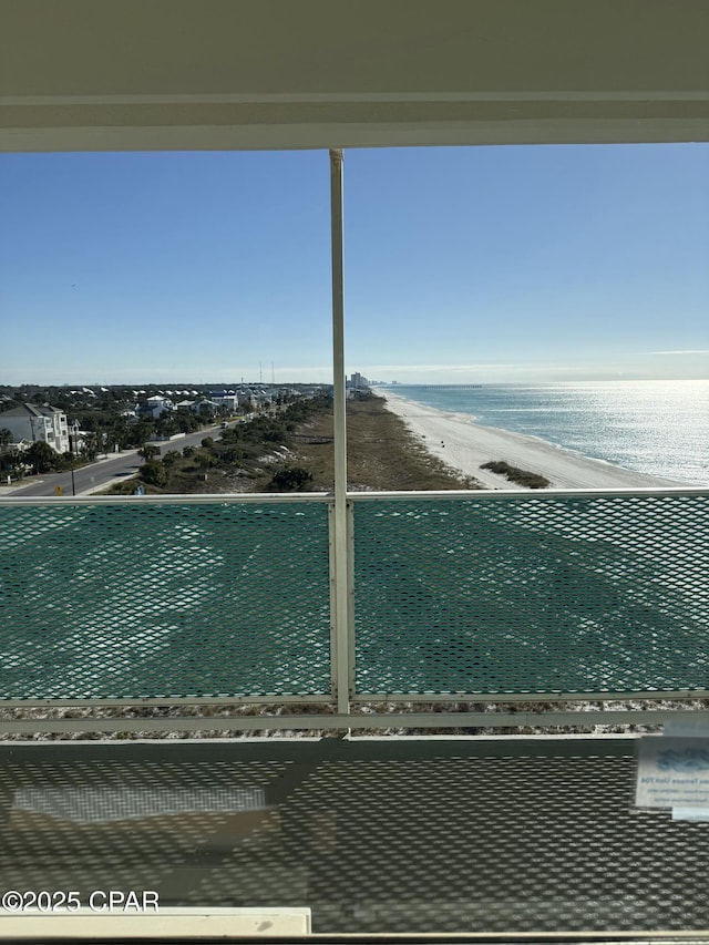 exterior space featuring a beach view and a water view