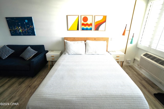 bedroom with dark wood-type flooring