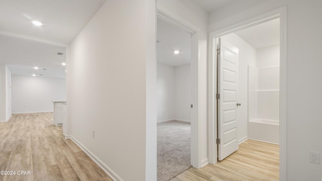 hallway featuring light hardwood / wood-style floors