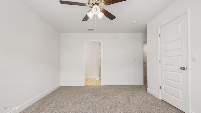 unfurnished bedroom with ceiling fan and light carpet